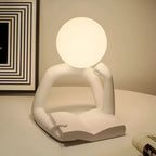 Nemsk | NovaMuse Reading Figure Table Lamp for Books with Sculptural Design